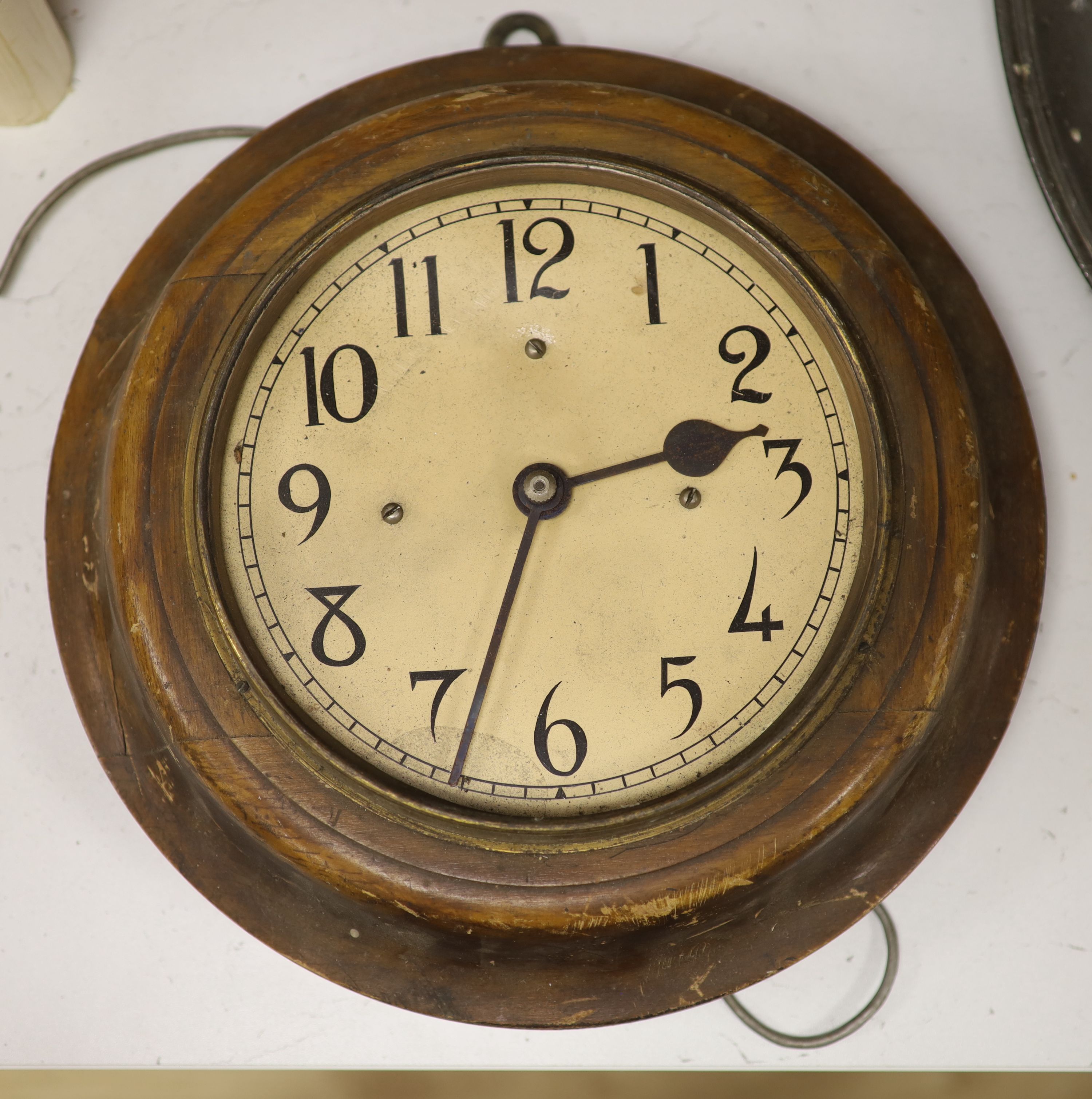 A stained wood electric slave dial, diameter 31cm